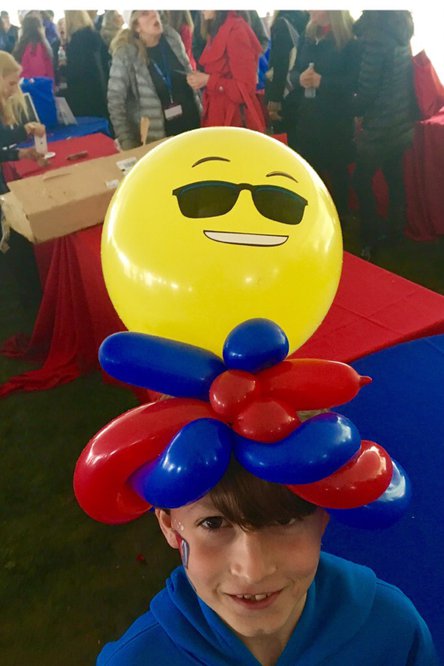 Emoji hat balloon twisting