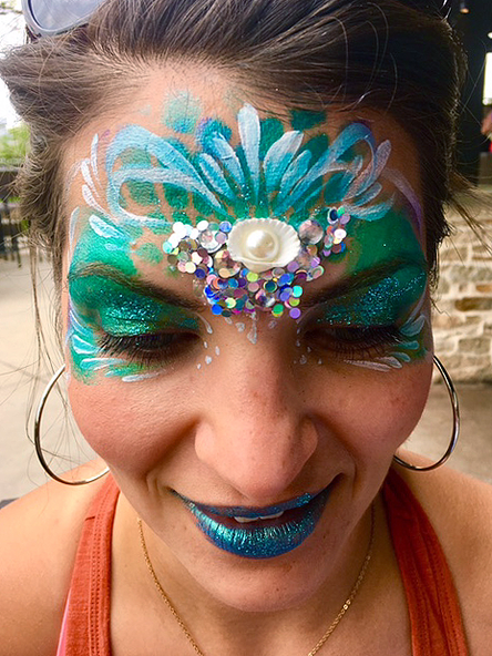 Fantasy face painting with sequins