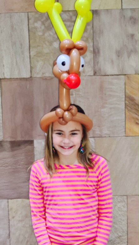 Balloon deer with red nose.
